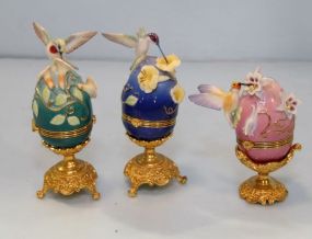 Three Porcelain Eggs on Stand