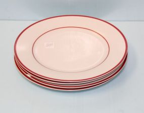 Four White and Red Dinner Plates