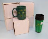 Five John Deere mugs and a coffee thermos