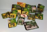 Various John Deere toys, sprayers, wagons, and tractors