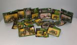 Various John Deere toys, sprayers, wagons, and tractors