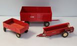 Three red metal  wagons