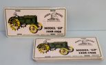 Twelve John Deere tags