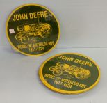 Sixteen 12'' round John Deere signs