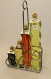 Four Decorative Bottles in Holder 