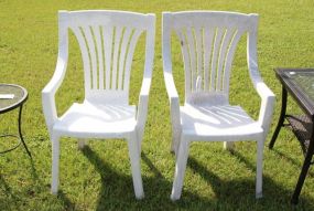 Pair of Plastic Arm Chairs 