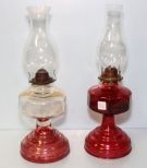 Two Red and Clear Oil Lamps