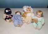 Four Porcelain Children Dolls