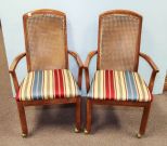 Two Cane Back Rolling Arm Chairs