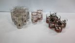 Six Holly Juice Glasses & Ten Coca Cola Glasses