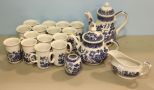 Two Blue Willow Teapots, Gravy Boat, Small Vase & Fifteen Mugs