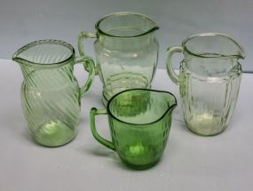 Four Green Depression Glass Pitchers