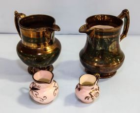Four Lusterware Pitchers