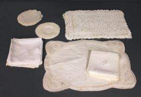 Group of Lace Tablemats and Whitework Embroidered Napkins Description