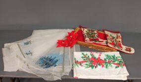 Group of Christmas Tablecloths, Stockings and Tablemats Description