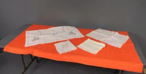 Group of Tablecloths, Napkins and Dresser Top Description