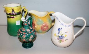 Four Various Size Pitchers