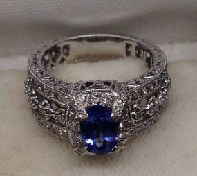 One Stamped 18KT White Gold Lady's Cast Sapphire and Diamond Ring