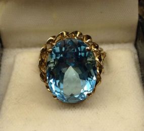 10KT Stamped Yellow Gold Ladies Blue Topaz Ring with a Bright Polish Finish.