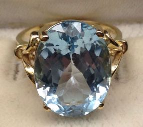 10KT Stamped Yellow Gold Ladies Blue Topaz Ring with a Bright Polish Finish