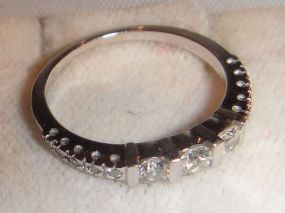 One Stamped 14KT White Gold Lady's Cast Diamond Band