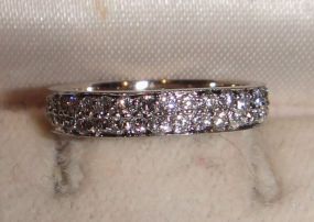 One Stamped 14KT White Gold Lady's Cast Pave' Diamond Band