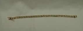 One stamped 10KT yellow gold uni-sex 7.5mm wide, 9