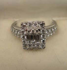 One stamped 14KT white gold lady's cast diamond ring
