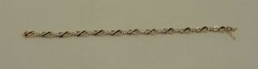 One stamped 14KT yellow gold lady's cast sapphire and diamond bracelet