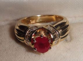 One stamped 14KT yellow gold lady's cast ruby and diamond ring