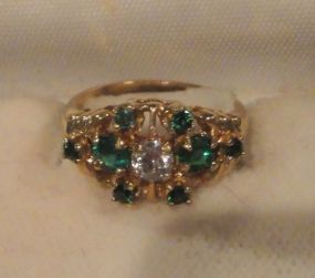 One stamped 14KT yellow gold lady's cast diamond simulant and emerald simulant filigree ring