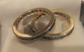 Two 10-14KT yellow gold lady's cast emerald simulant bands
