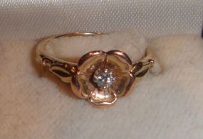 One 10-14KT yellow gold lady's cast diamond rose ring. Size 6 1/4.