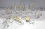 Group of Glasses and Glass Candleholders