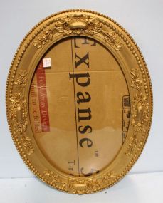 Antique Gold Carved Frame with Oval Glass