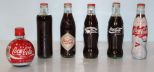 Six Coke Bottles