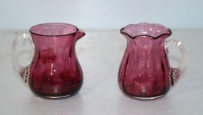Two Small Cranberry Pitchers