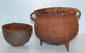 Two Iron Footed Pots