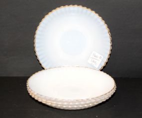 Four Opalescent with Gold Trim Saucers