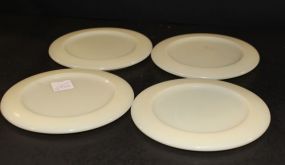 Four Custard Glass Trivets