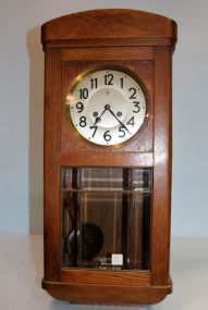 Oak German Wall Clock with Bevelled Glass