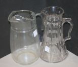 Two Clear Glass Pitchers