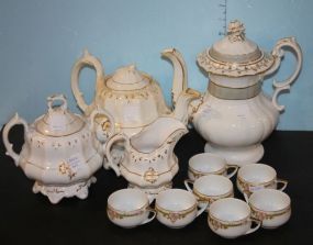 Two Porcelain Teapots, Sugar Bowl, Creamer, and Five Small Cups
