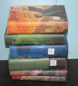 Group of Six Hard Back Harry Potter Books with Original Paper Covers