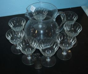 Glass Pitcher, Eight Glasses, and Small Bottle