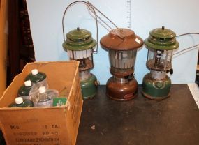 Three Coleman Lanterns and Four Bottles of Propane Fuel