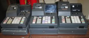 Three Datasym 6000 Series Cash Registers