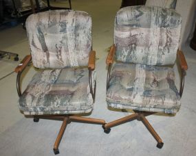 Two Swivel Arm Chairs