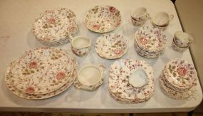 Forty-three Pieces of Rose Chintz by Johnson Brothers and Three White Nut Dishes Consisting of six dinner plates, seven salad plates, six bread and butter plates, six cups and saucers, seven berry bowls, one vegetable bowl, one cereal bowl, two 