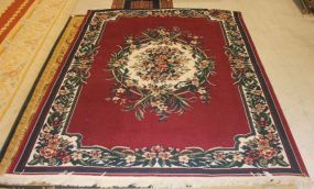 Dayln Rug Company Aubusson, dominate color is maroon, has center medallion; 5' 6